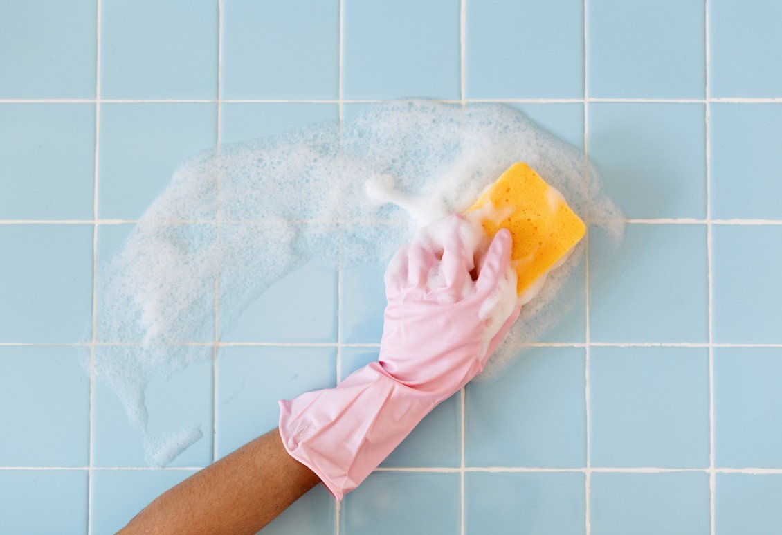 Bathroom deep cleaning with grout scrubbing and sanitation.
